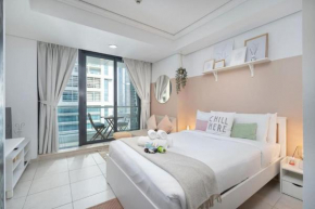 Waves - Cozy Studio with Balcony & Partial Lake Views